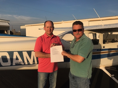 Photo of a flight student earning his solo